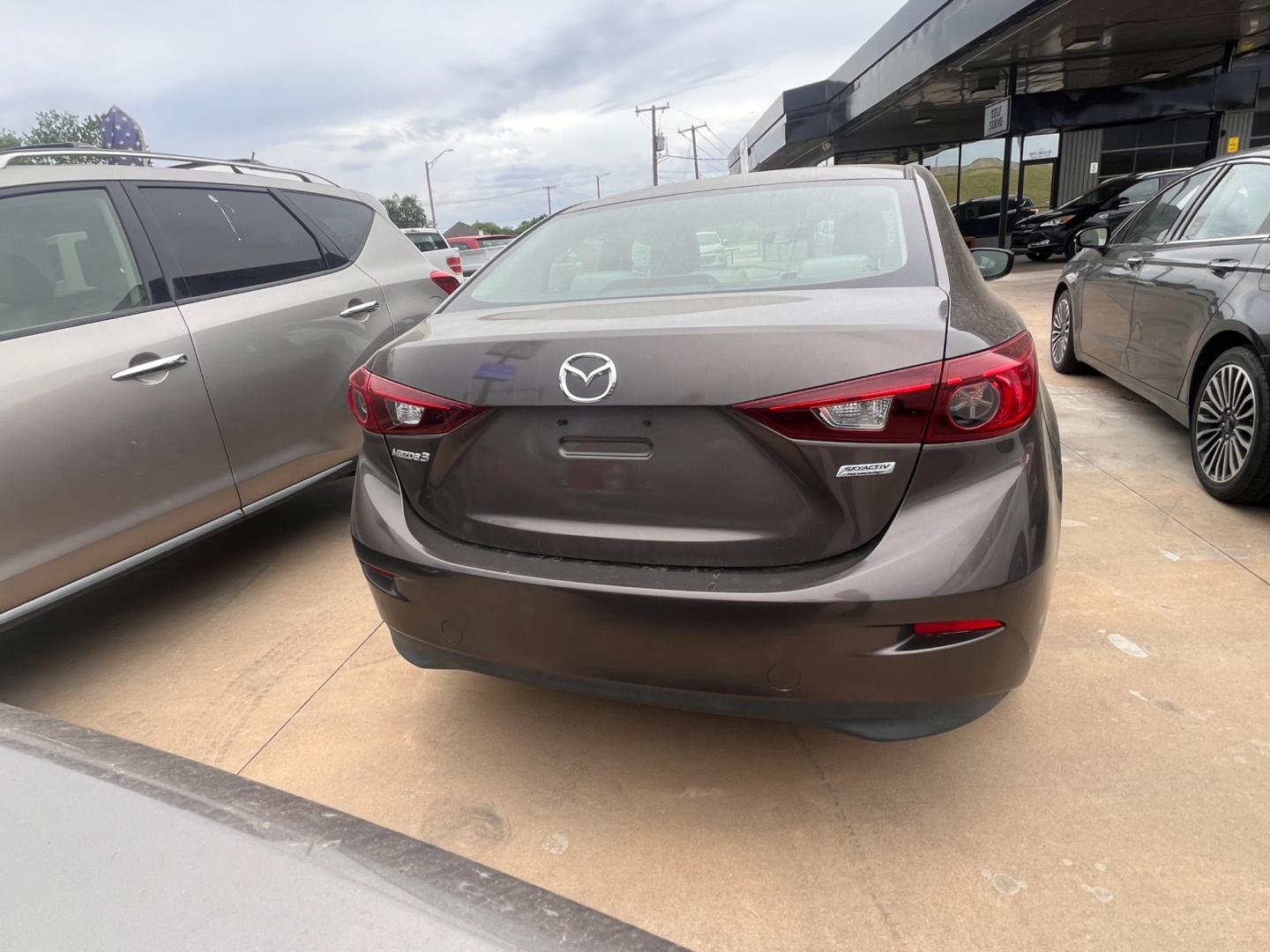 2015 BEIGE MAZDA MAZDA3 I SPORT W/SKY i Sport AT 4-Door (3MZBM1U73FM) with an 2.0L L4 DOHC 16V engine, 6-Speed Automatic transmission, located at 8101 E. Skelly Dr., Tulsa, OK, 74129, (918) 592-3593, 36.121891, -95.888802 - Photo#3